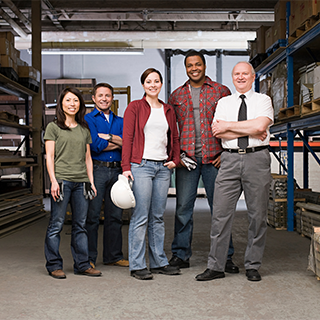group of workers standing in warehouse